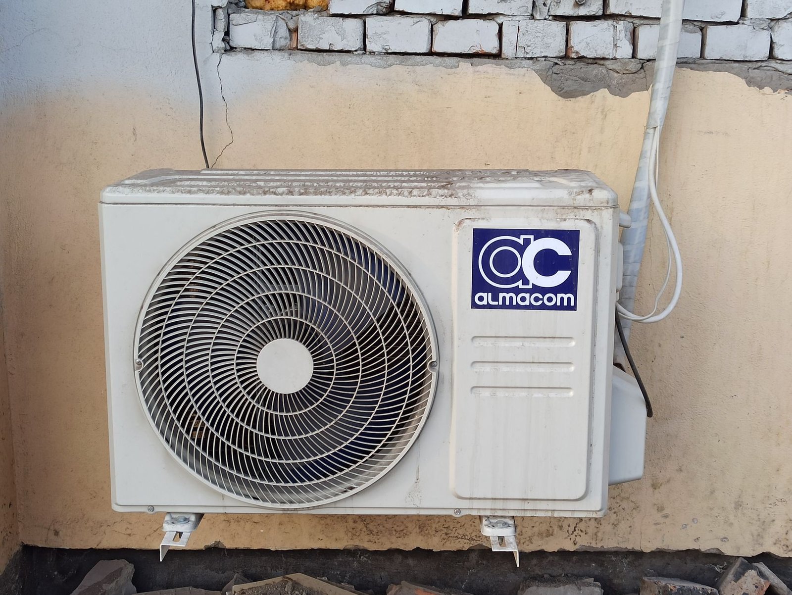 A clean white mini split line set cover installed on a modern house exterior.